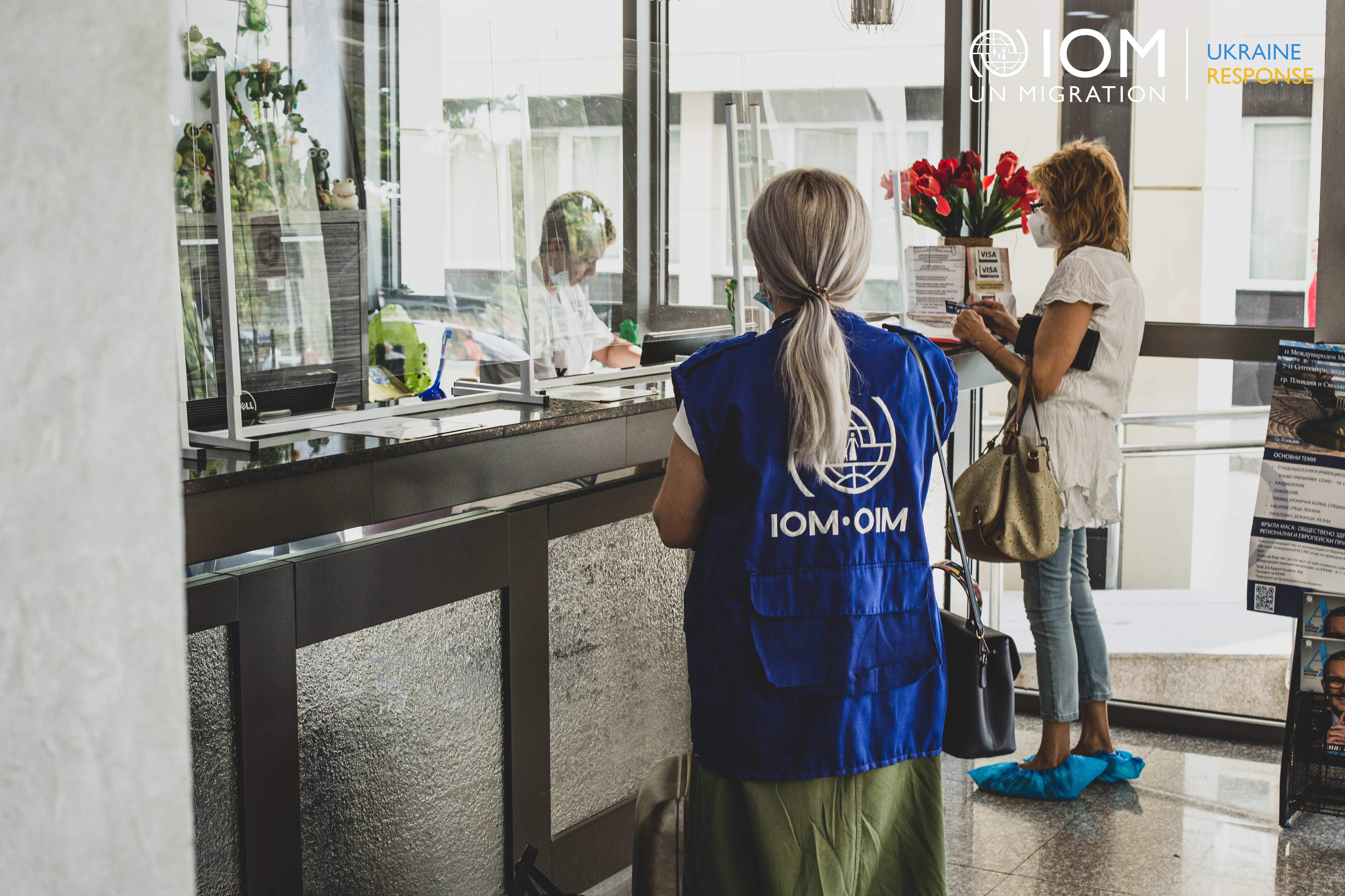 IOM team member registering a beneficiary for a medical examination