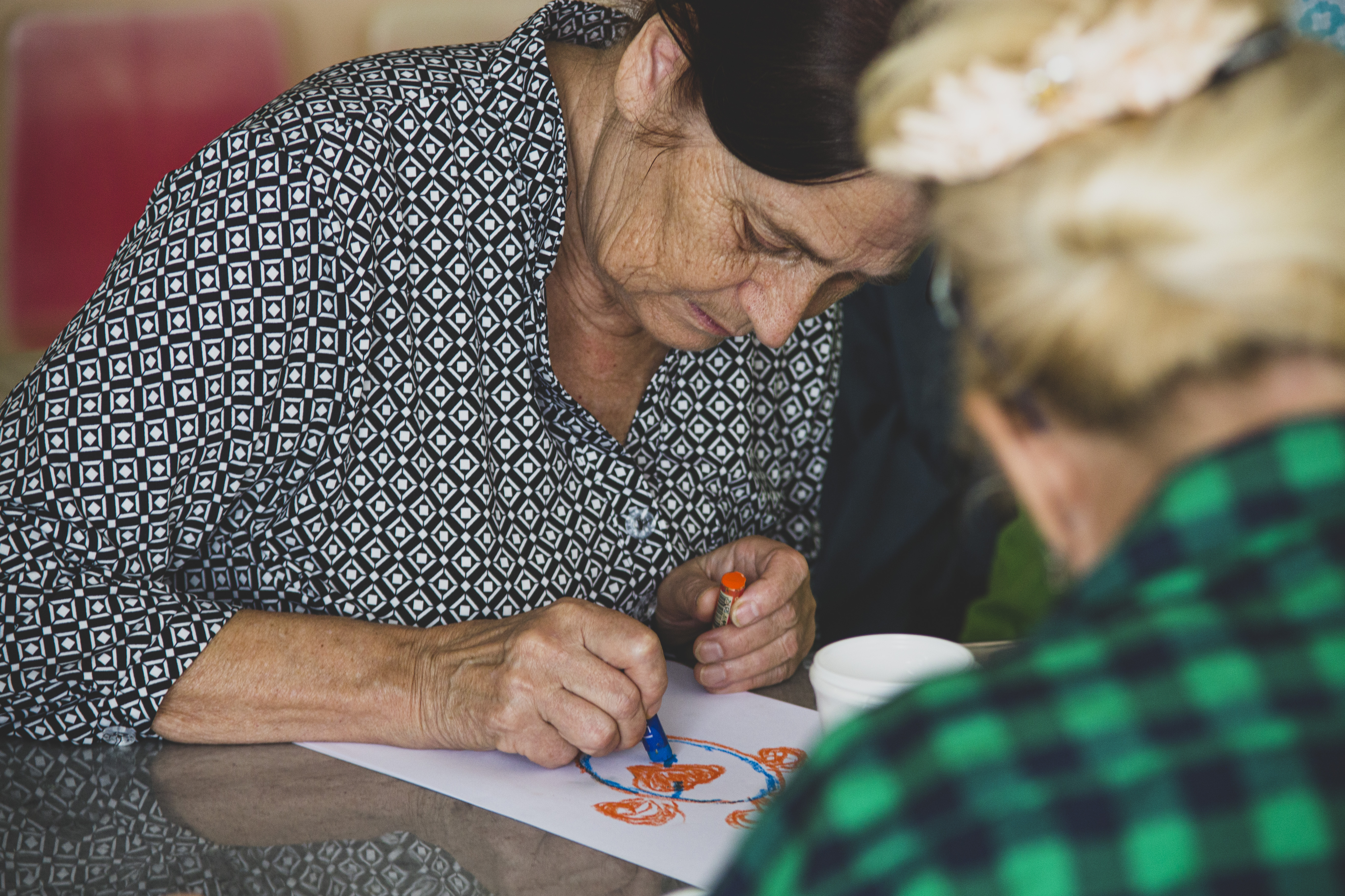elderly woman drawing