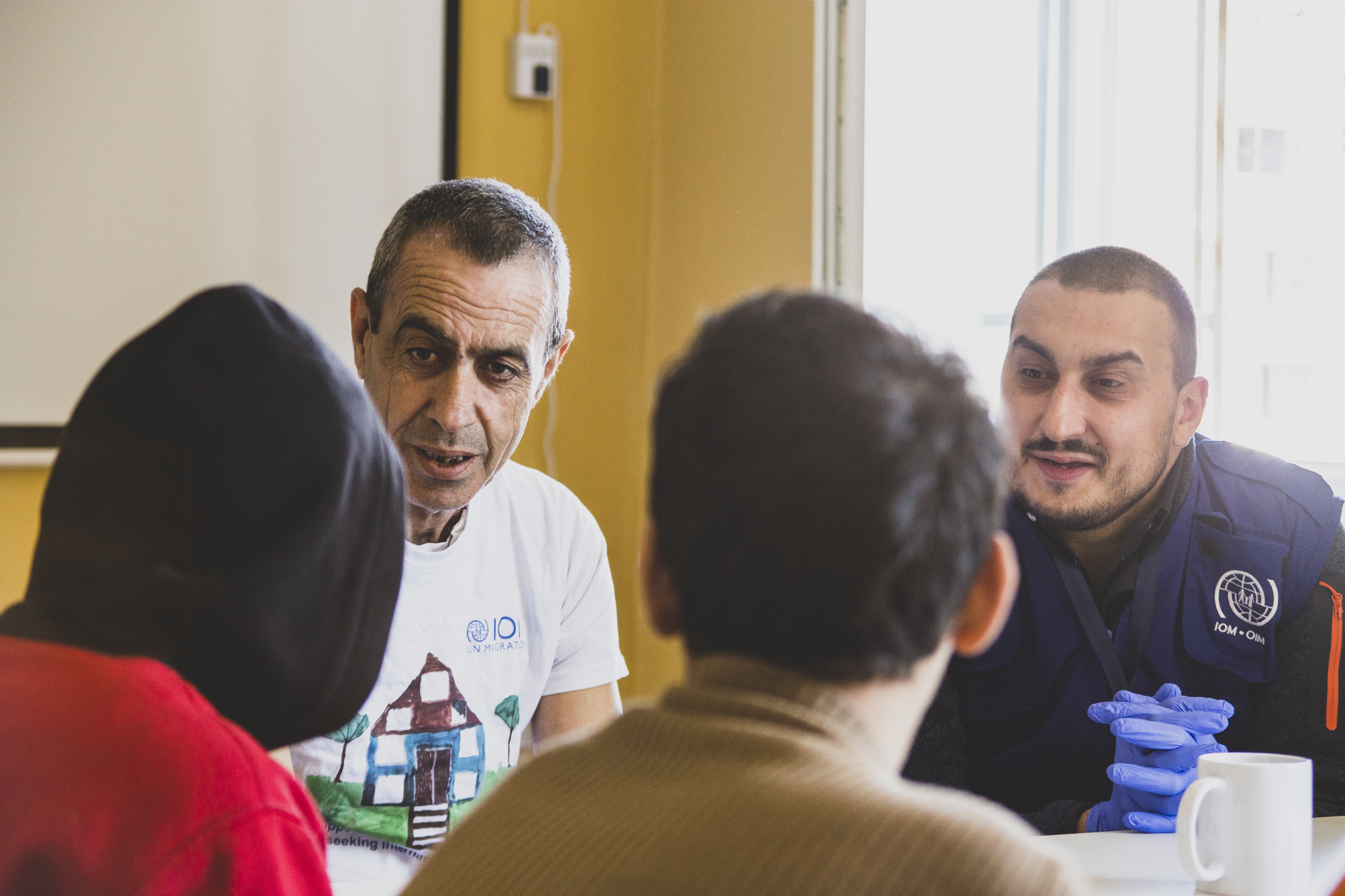 IOM staff during a discussion with the unaccompanied minors at RRC Sofia - Ovcha Kupel